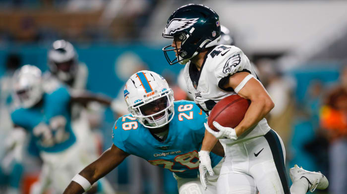 Philadelphia Eagles wide receiver Britain Covey (41) runs with the football ahead of Miami Dolphins running back Salvon Ahmed (26) during the fourth quarter at Hard Rock Stadium.